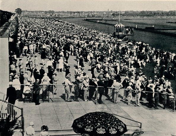 The Arlington Race Track, Chicago, c1930. Arlington International Racecourse was founded as Arlington Park by California businessman Harry D. Curly Brown. The track officially opened in 1927 to 20,000 spectators. From Flat Racing published by Seeley, Service & Co, Ltd., London, 1940.  (Photo by Print Collector/Getty Images)